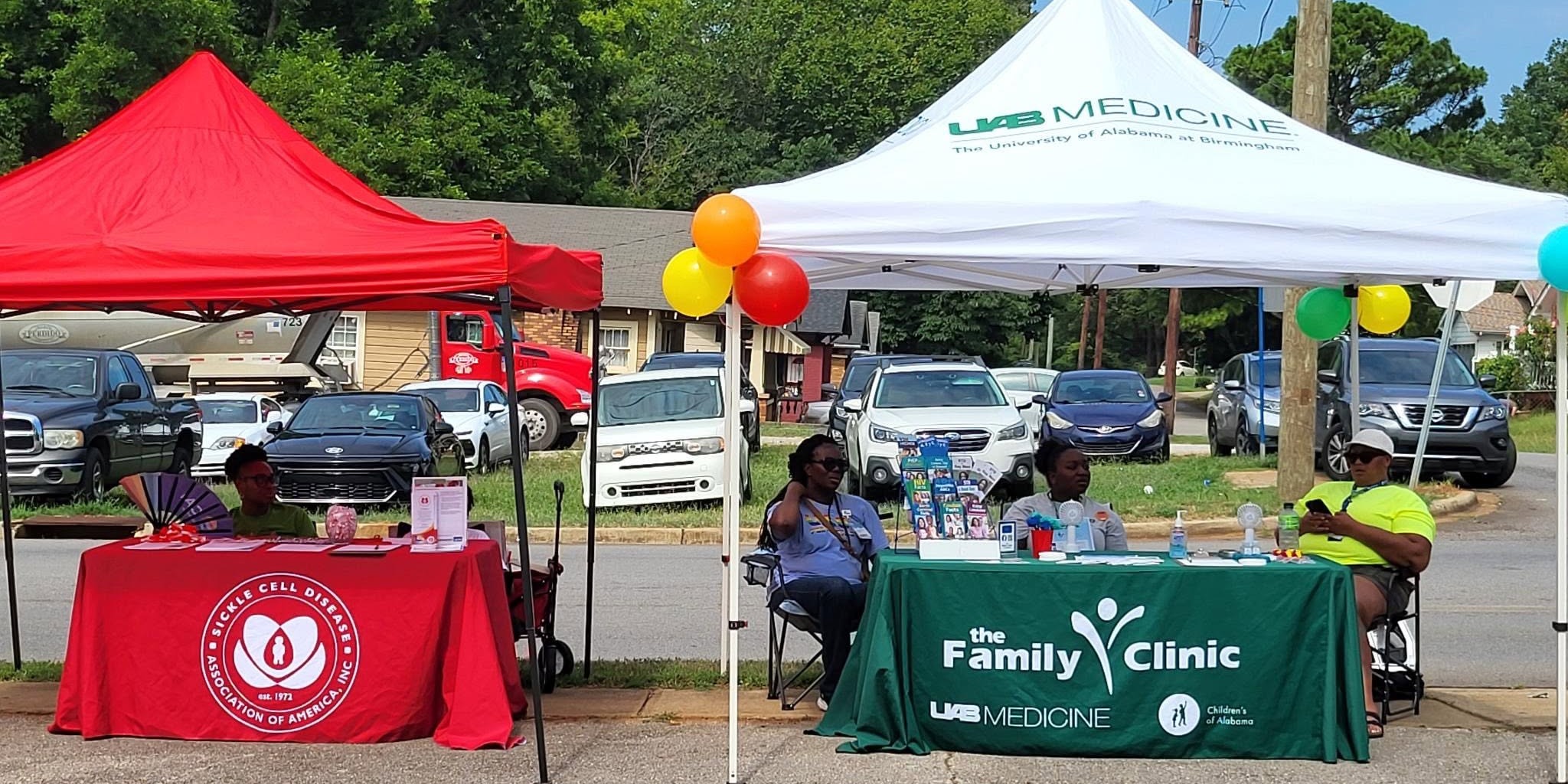 BI volunteers tabling at a community health fair